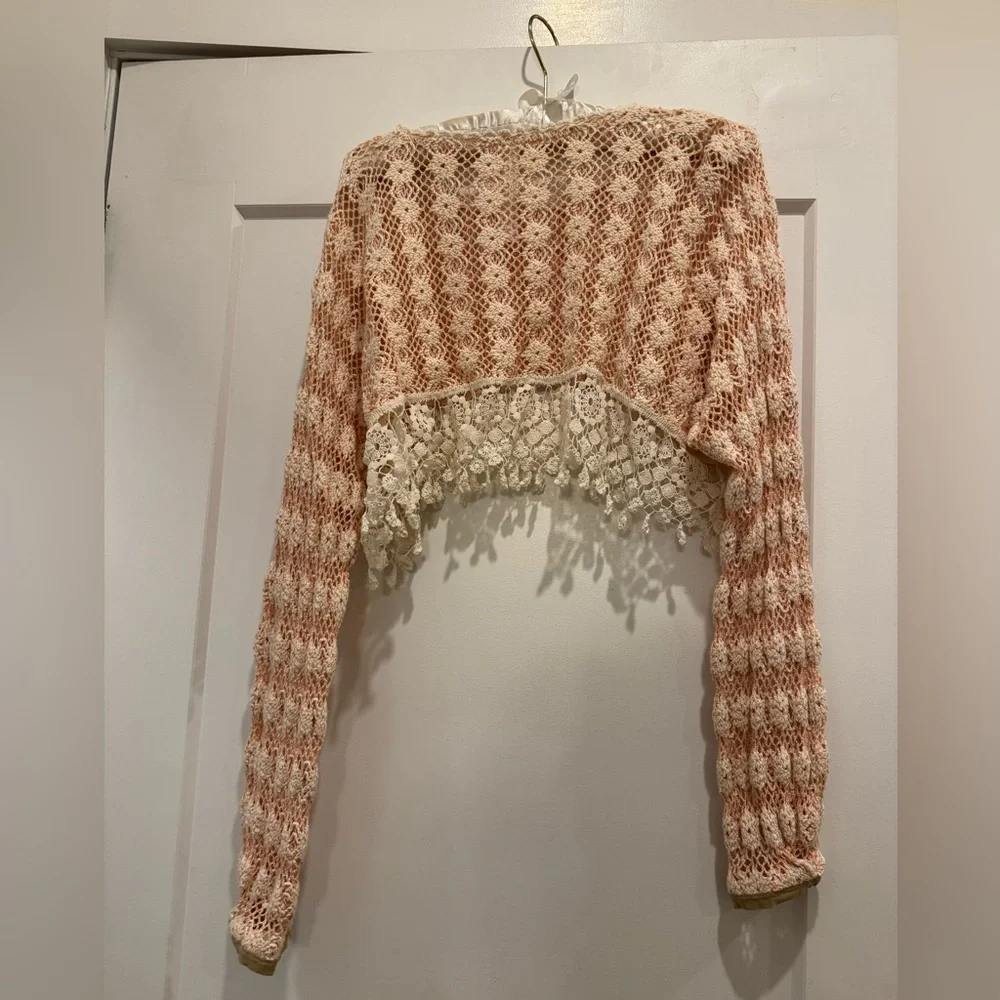 Lace pink and cream Free People crochet trim cropped long sleeve sweater